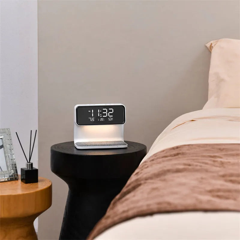 White 3-in-1 bedside lamp with wireless charging pad, LCD alarm clock display, and touch controls.