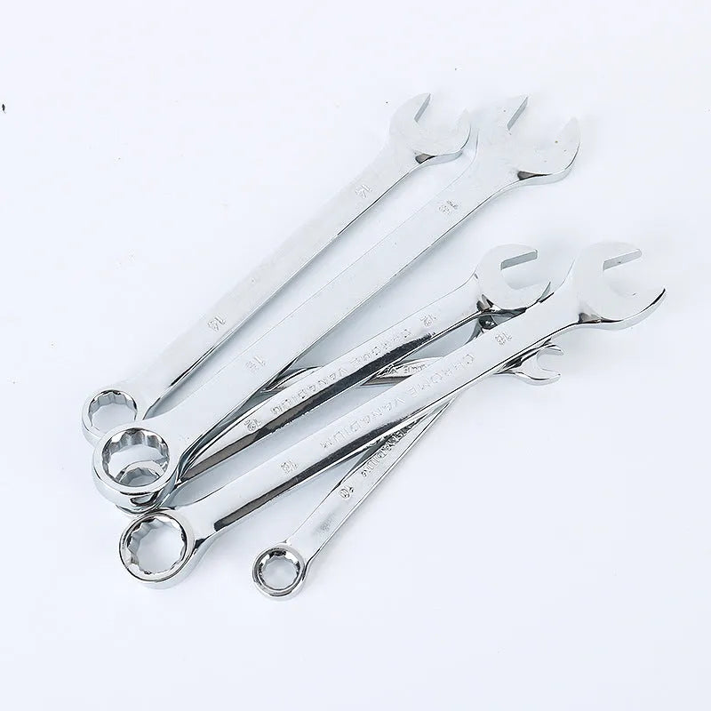 61-piece chrome vanadium steel socket wrench tool set laid out with ratchets, sockets, and wrenches on a workbench.