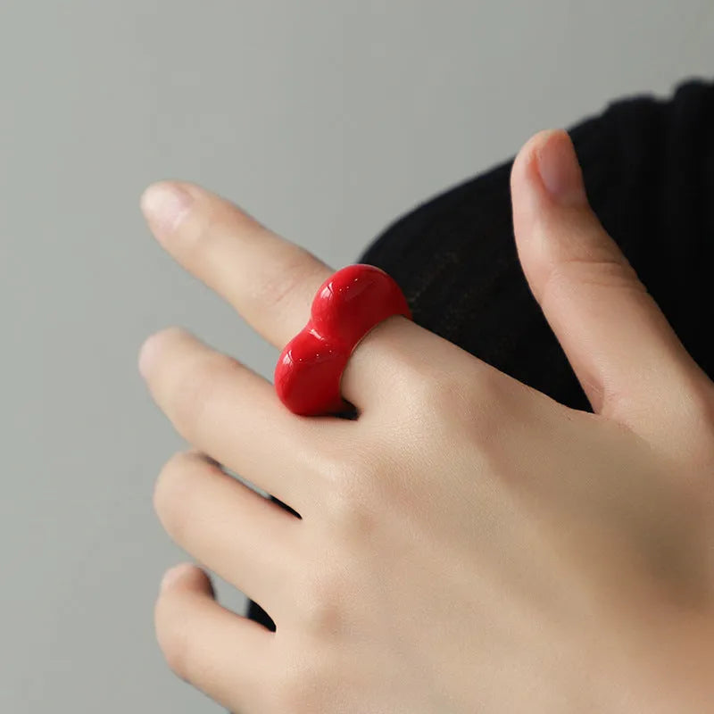 Original three-dimensional enamel heart ring in zinc alloy, shown in black, pink, purple, or red.