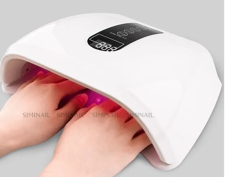 White 96W LED nail dryer with infrared sensor and removable base tray for gel polish curing