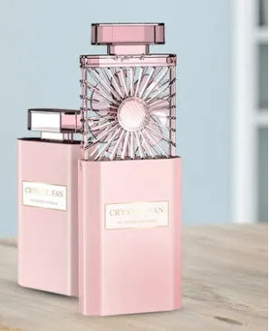 Pink handheld perfume fan with rechargeable battery and USB charging port