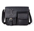 Brown full-grain leather vintage messenger bag with front flap, shown open to reveal internal laptop sleeve and pockets.