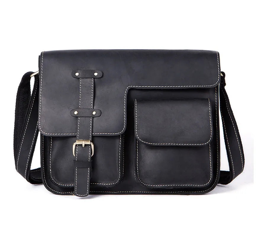 Brown full-grain leather vintage messenger bag with front flap, shown open to reveal internal laptop sleeve and pockets.