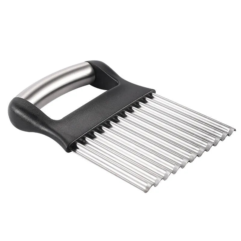 Stainless steel potato wave knife for making crinkle-cut chips on a wooden board
