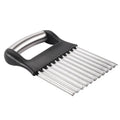 Stainless steel potato wave knife for making crinkle-cut chips on a wooden board