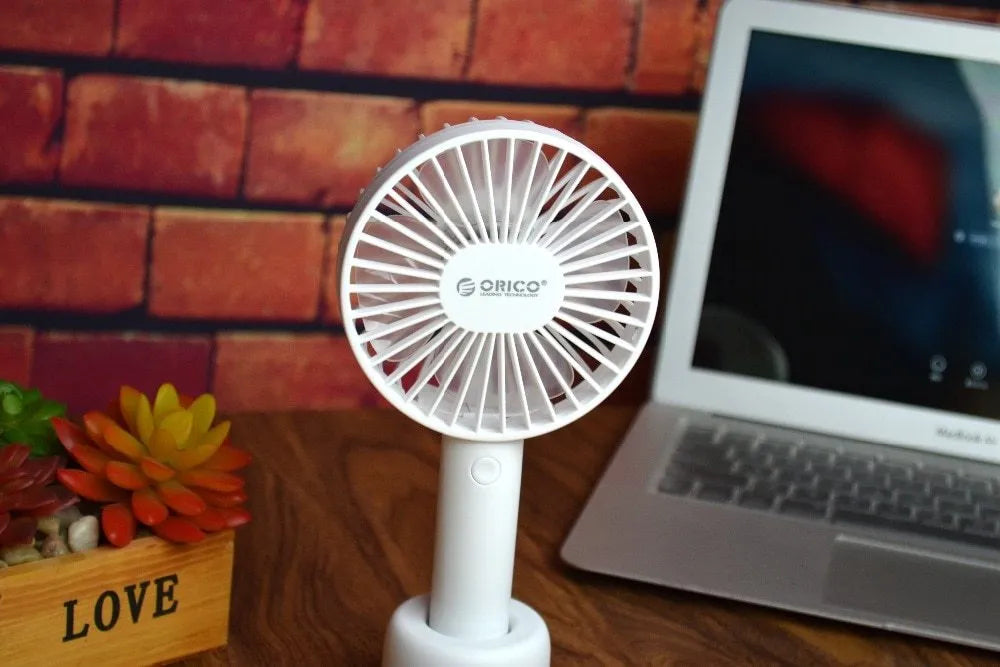 White ORICO FH1 USB rechargeable portable desktop fan with three-speed settings.