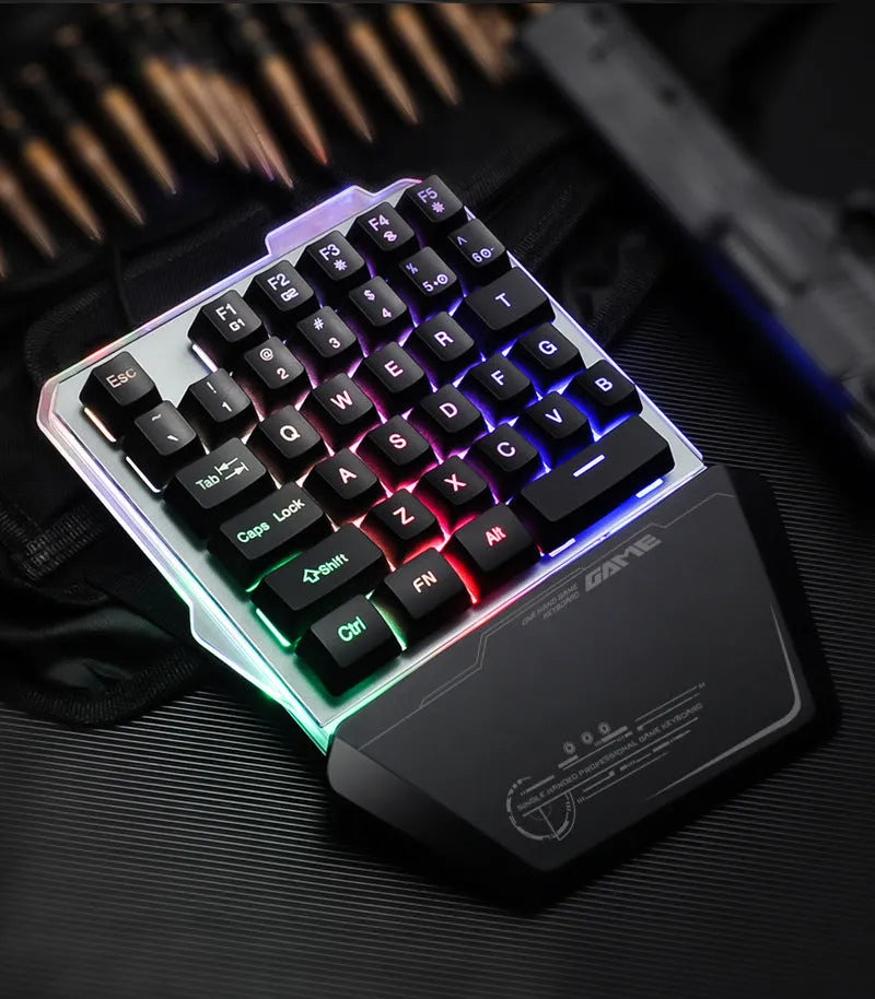 G40 Flow black one-handed mechanical keyboard with RGB backlit keys on a desk