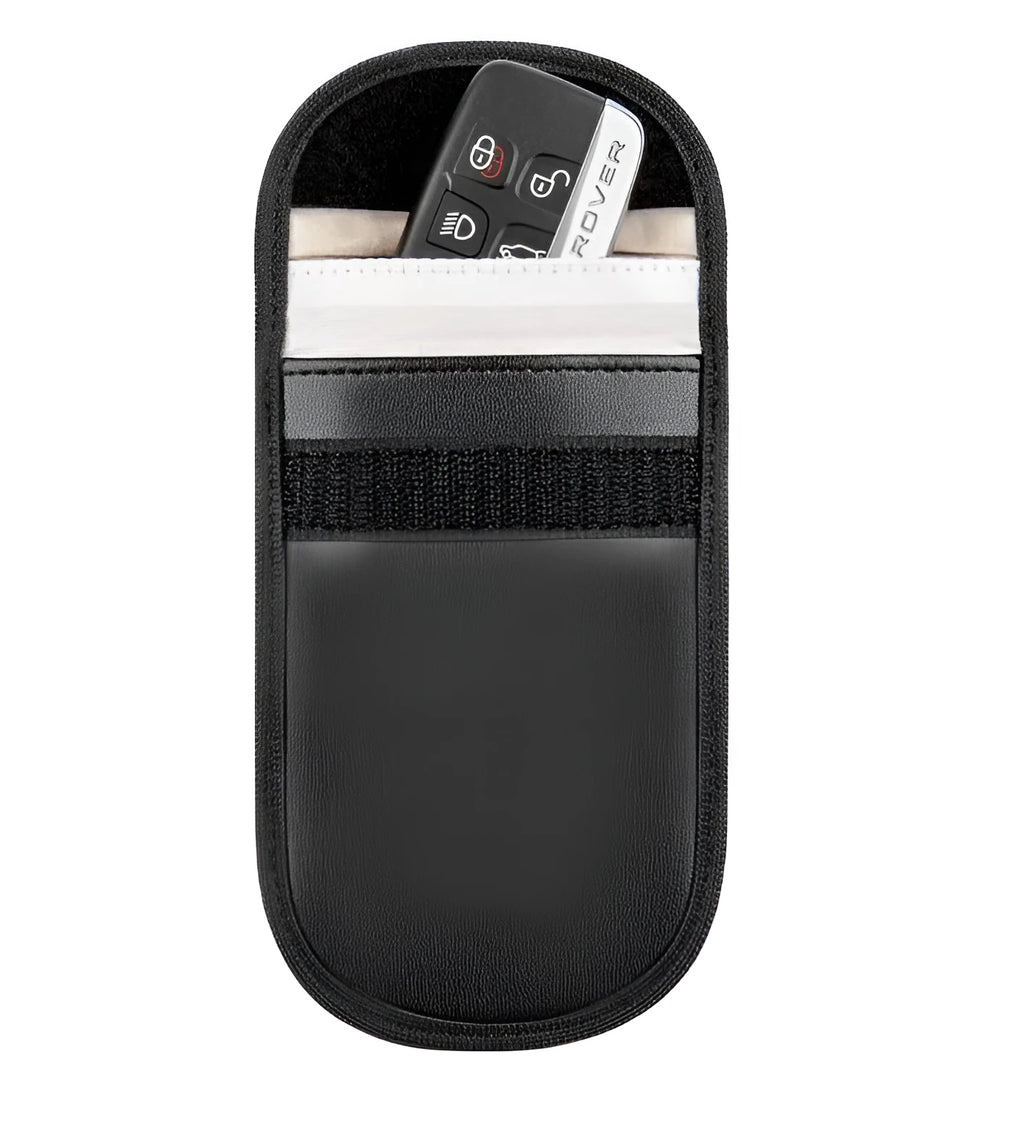 Black plain microfiber faraday cage bag for blocking RFID and phone signals, shown with a key fob inside.