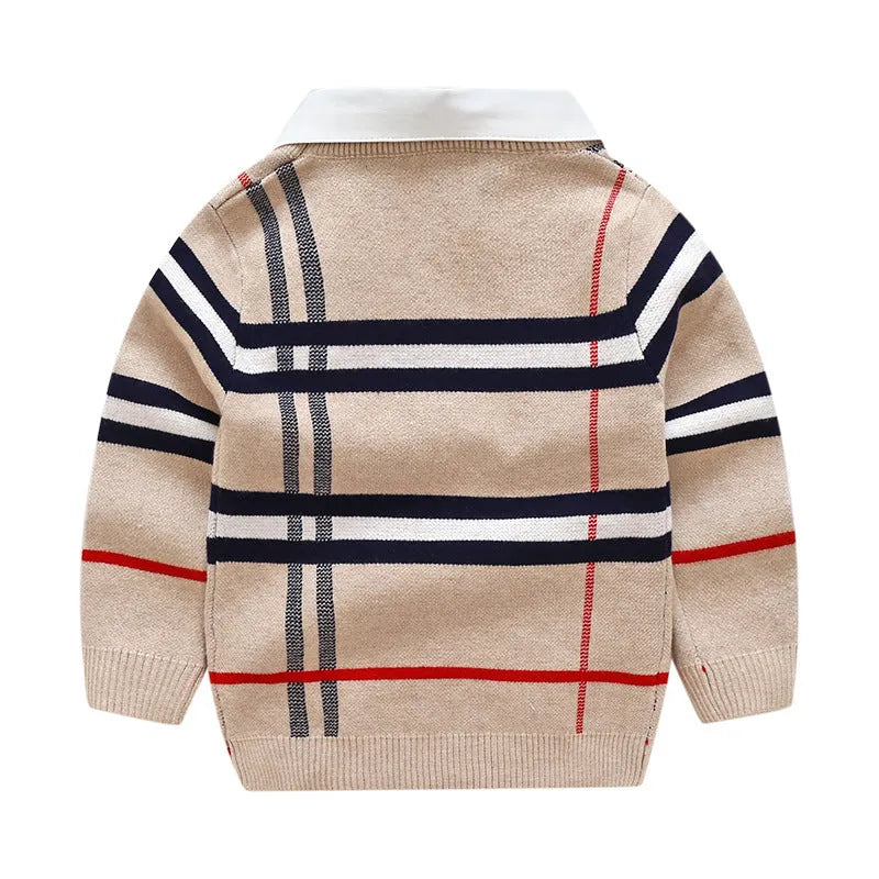 Boy wearing a navy blue plaid jacquard knit pullover sweater