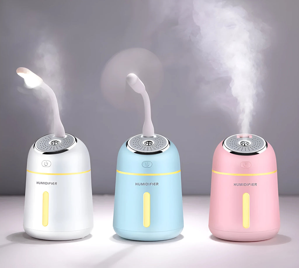 USB aromatherapy machine in white, pink, and blue with 330ml water tank and compact 96x96x139mm size
