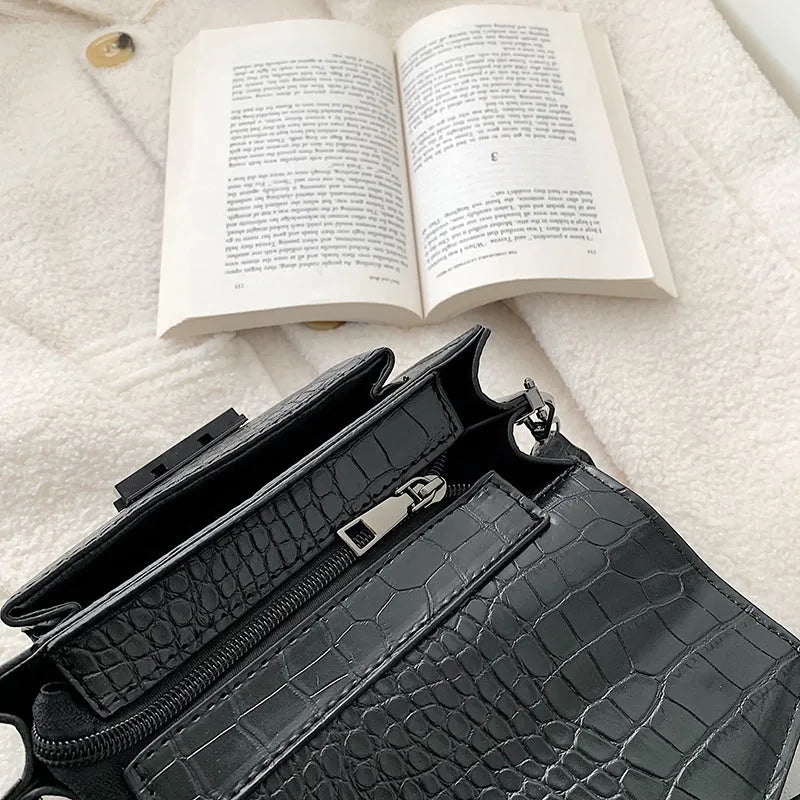 Vintage PU leather crossbody bag shown in black, dimensions 20cm by 14cm.
