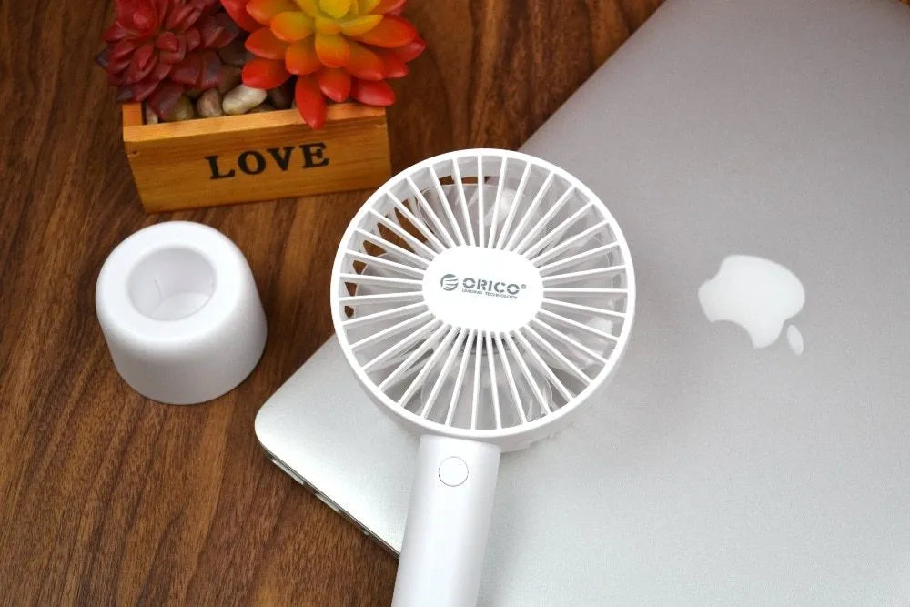White ORICO FH1 USB rechargeable portable desktop fan with three-speed settings.