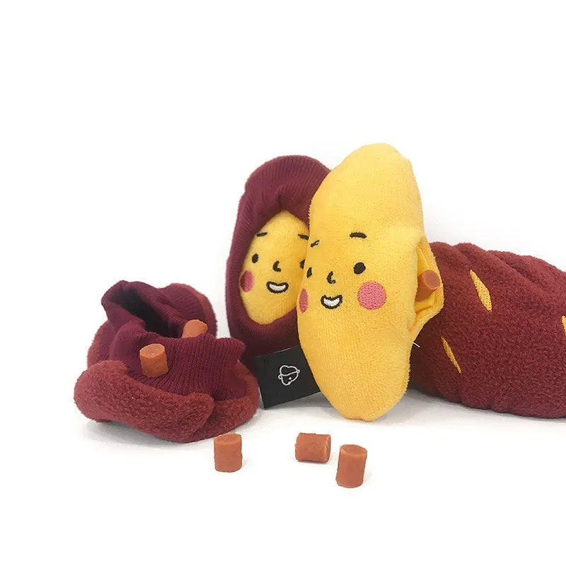 Red sweet potato shaped pet puzzle toy with hidden treat compartment and amusing face expression
