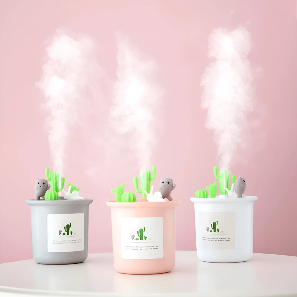 Vase-shaped ultrasonic pet humidifier in cherry blossom pink, with USB cable and water tank.