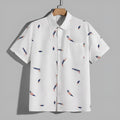 Men's feather pocket short sleeve cotton blend cardigan in white, yellow, and blue print, front view.