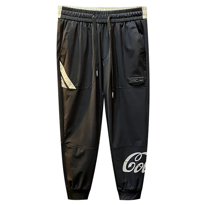Man wearing black ultra-thin ice silk cropped trousers with a banded ankle cuff.
