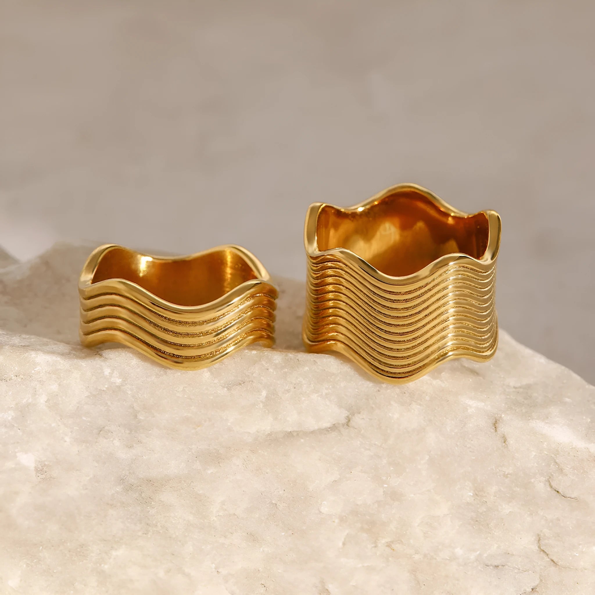 Stainless steel wide band ring with geometric wave pattern and polished electroplated finish