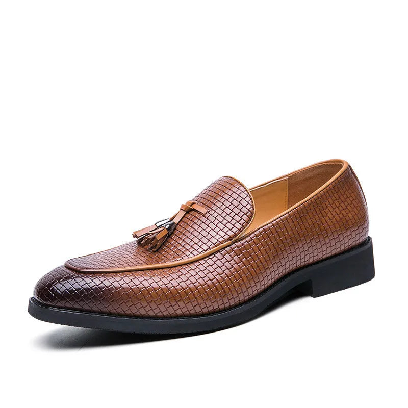 Men's black pointed toe slip-on shoes with a tassel detail on the artificial PU upper.