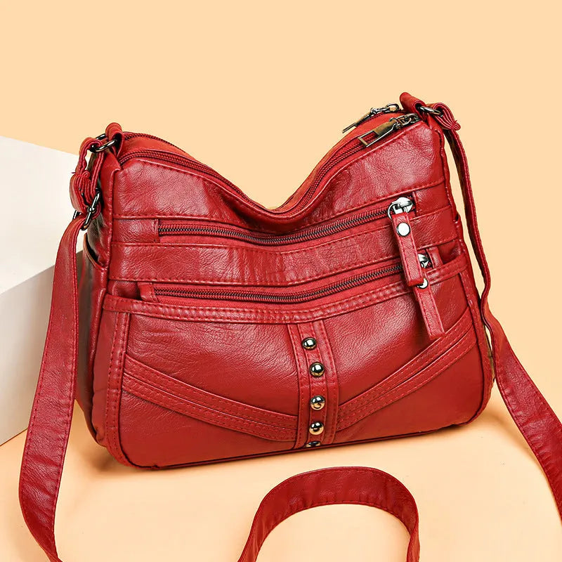 Ladies soft PU messenger bag in vintage style, available in black, brown, and red, horizontal square shape
