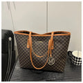 Western style women's shoulder bag in PU leather with contrast stitching, shown in black.