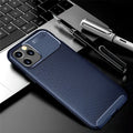 Black silicone protective phone case for iPhone 12 on a table.
