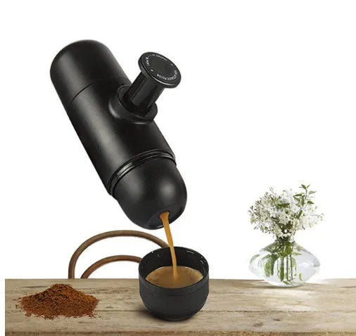 Black portable manual espresso machine showing 6cm diameter and 17.5cm height with stainless steel and plastic components.