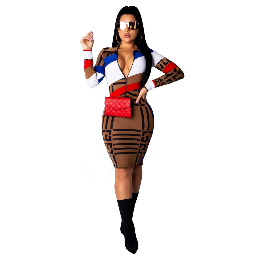 Multicolor mosaic geometry pattern long sleeve printed dress with zipper closure on a woman against a white background.