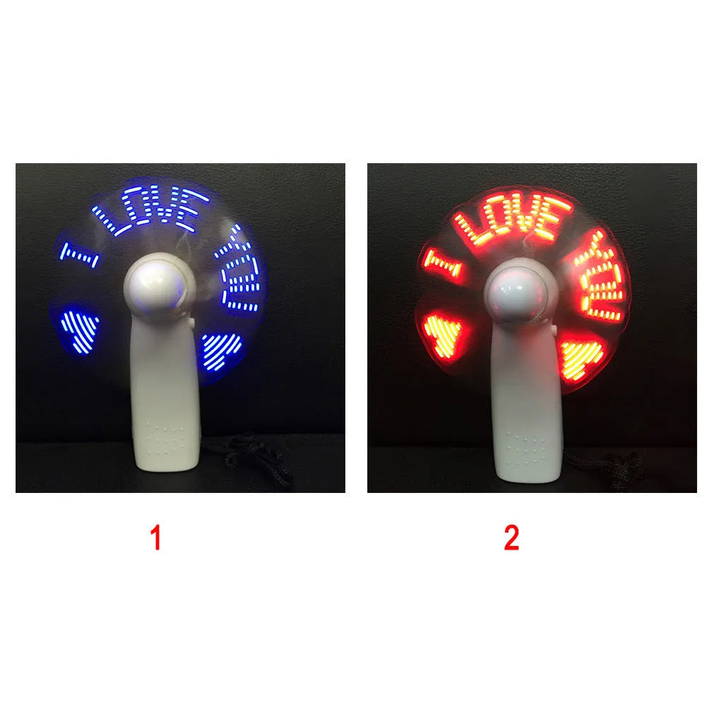 White mini handheld fan showing blue and red LED lights forming 'I Love You' message on its front.