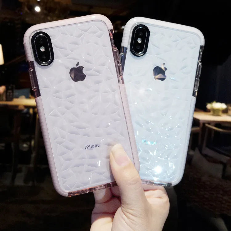 Striped pink and white TPU back cover case for iPhone on a table.