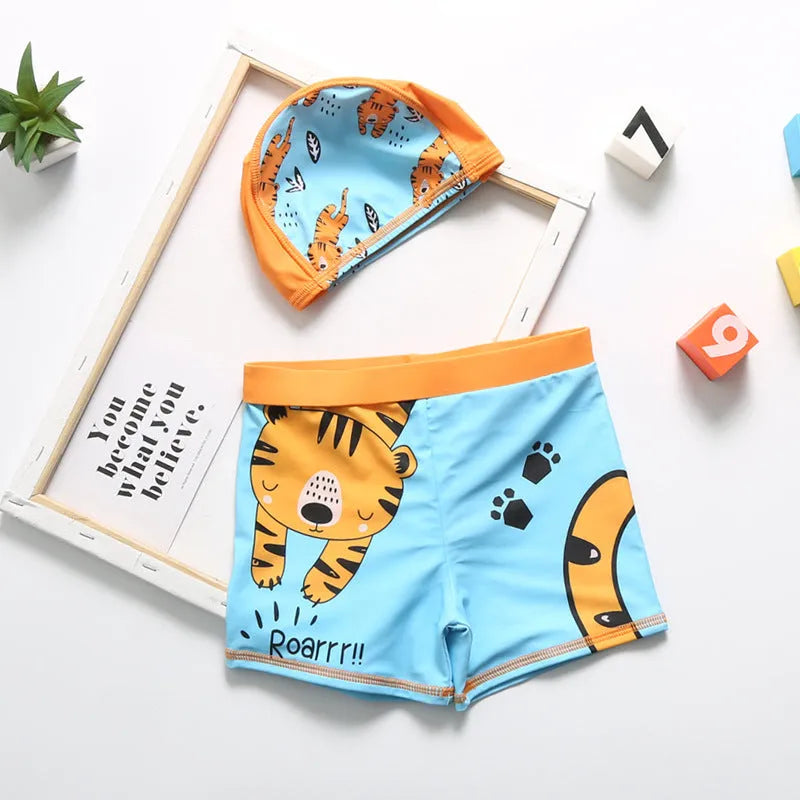 Cartoon dinosaur swimming trunks set for boys in light blue, dark blue, and orange colours