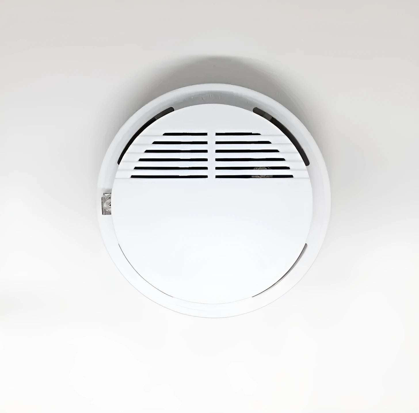 White ceiling mount household smoke alarm model SS-168 with 60m detection range