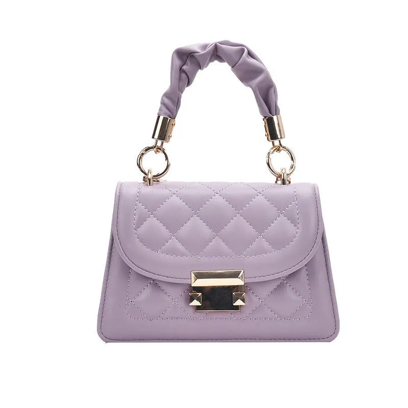 Purple trapezoidal square messenger bag with long crossbody strap shown alongside black and beige colour options