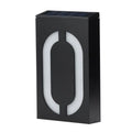 White solar-powered house number light with visible solar panel and LEDs, mounted on a wall.