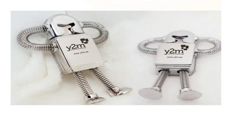 Metal robot U disk in silver with spring-extended USB connector on a white background