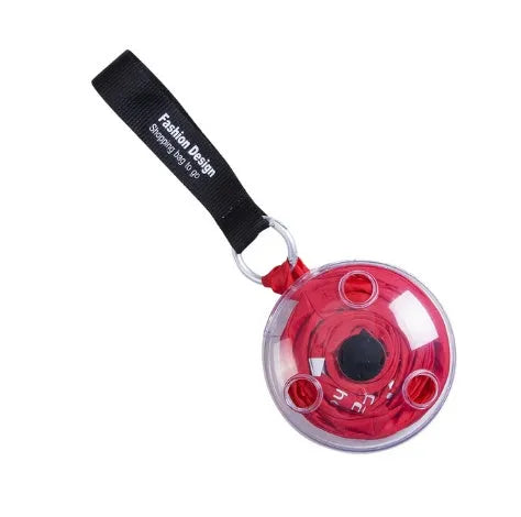 Disc folding portable shopping bag in red unfolded showing 33x40x10cm size with compact 10.5cm disc beside it