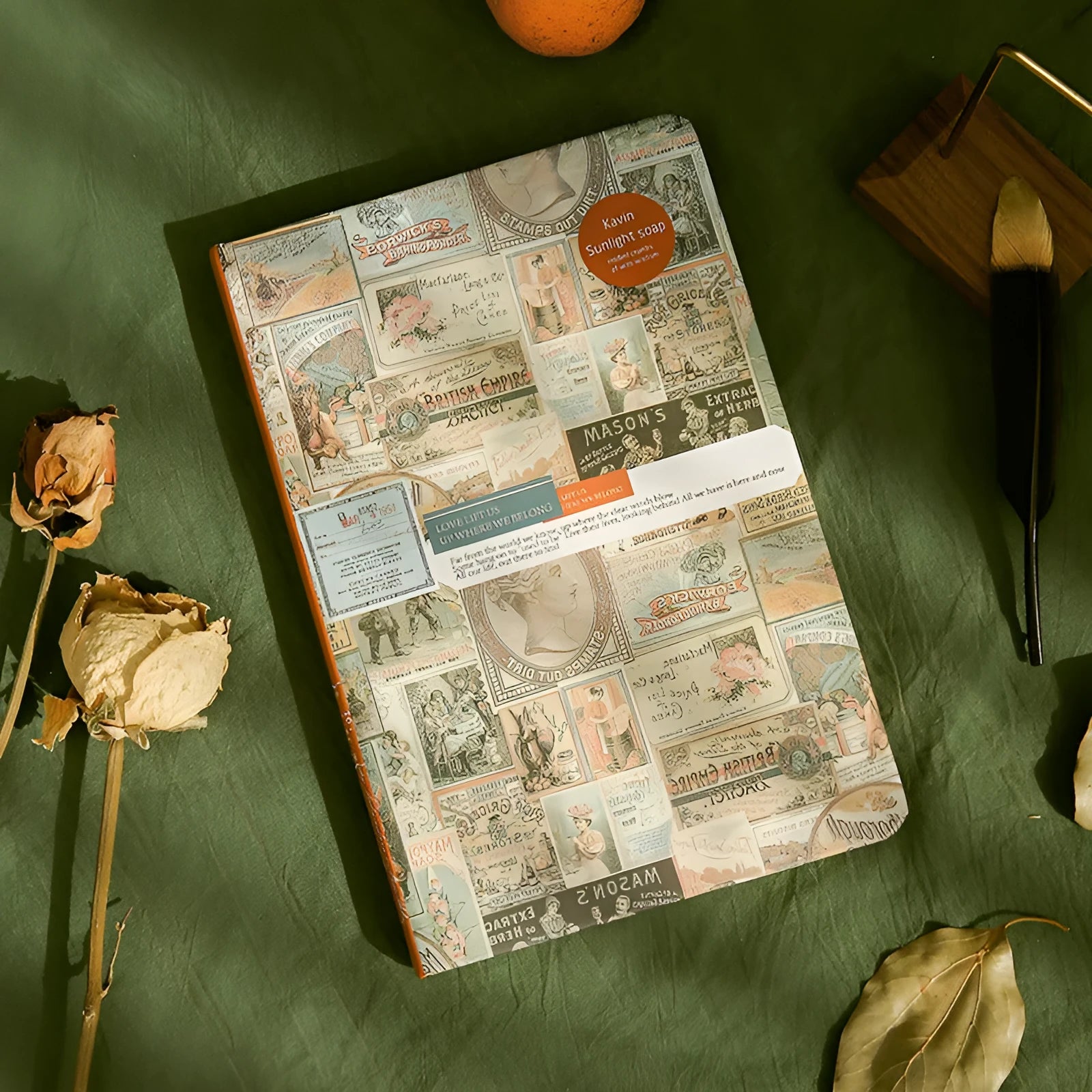 Blue kraft paper A5 illustration notebook with retro design, open to show colour pages.