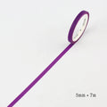Hand-roll of solid colour paper tape in crimson and deep purple, showing narrow 5mm width.