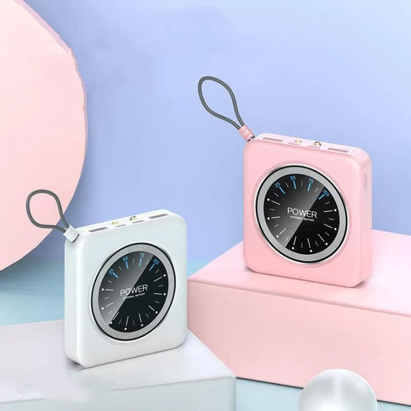 Compact alloy-cased portable power bank in mint green with multiple USB output ports on a white background.