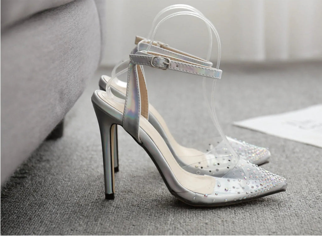 Women's pointed toe stiletto sandals with crystal diamond decoration on a PVC upper.