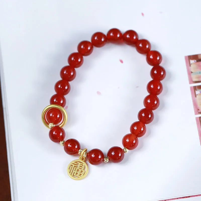 Natural red agate bracelet with woven design and blessing card, shown in 10mm bead size.