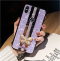 Clear acrylic iPhone case with a sparkling butterfly design and a reflective mirror surface.
