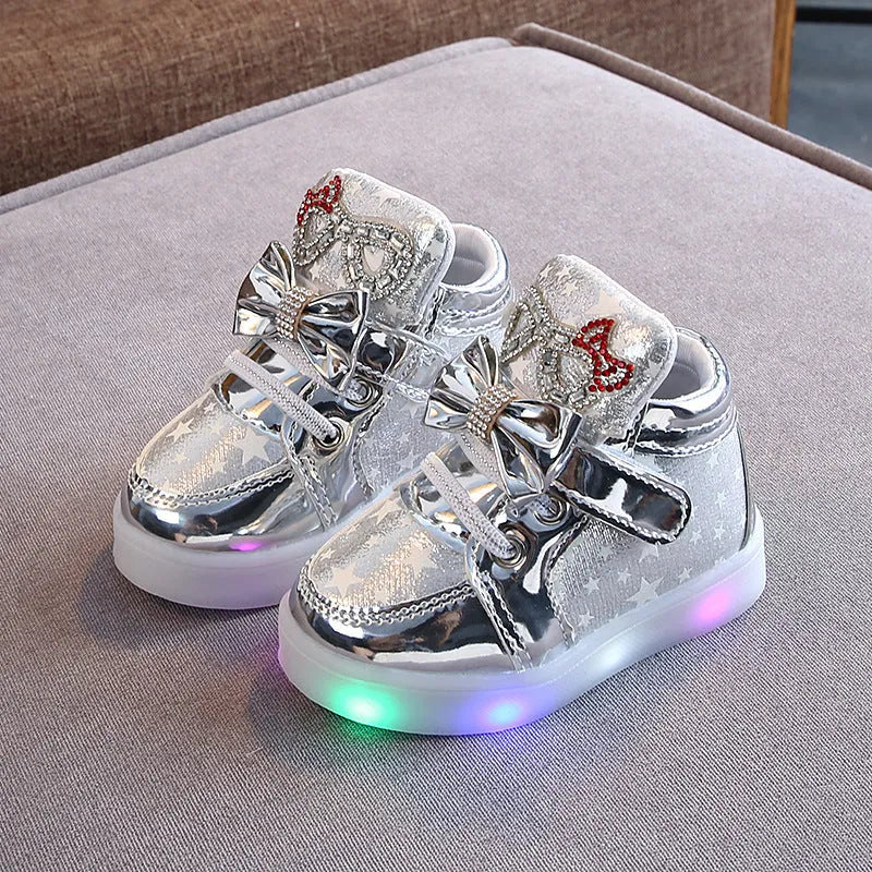 Golden, pink and silvery children's LED shoes with light-up soles, showing size chart from 21 to 30cm.
