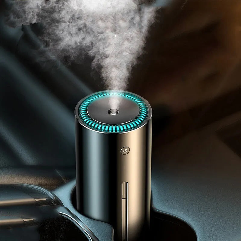 Black aluminium alloy car diffuser humidifier with USB cable on a car dashboard.