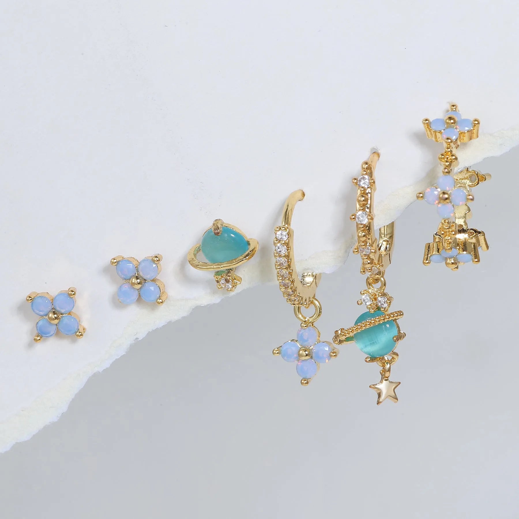 Gold and silver blue floral stud earrings with zircon mosaic on copper.