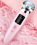 Pink portable skin rejuvenation and facial cleansing beauty instrument showing its compact size.