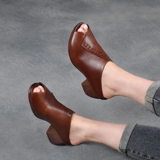 Women's black peep-toe slipper with a square heel and fish mouth opening, shown on a white background.