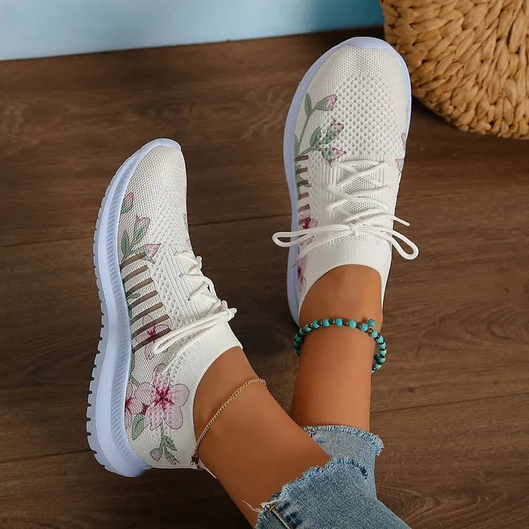 White women's mesh knit running shoes with round toe and flat rubber sole