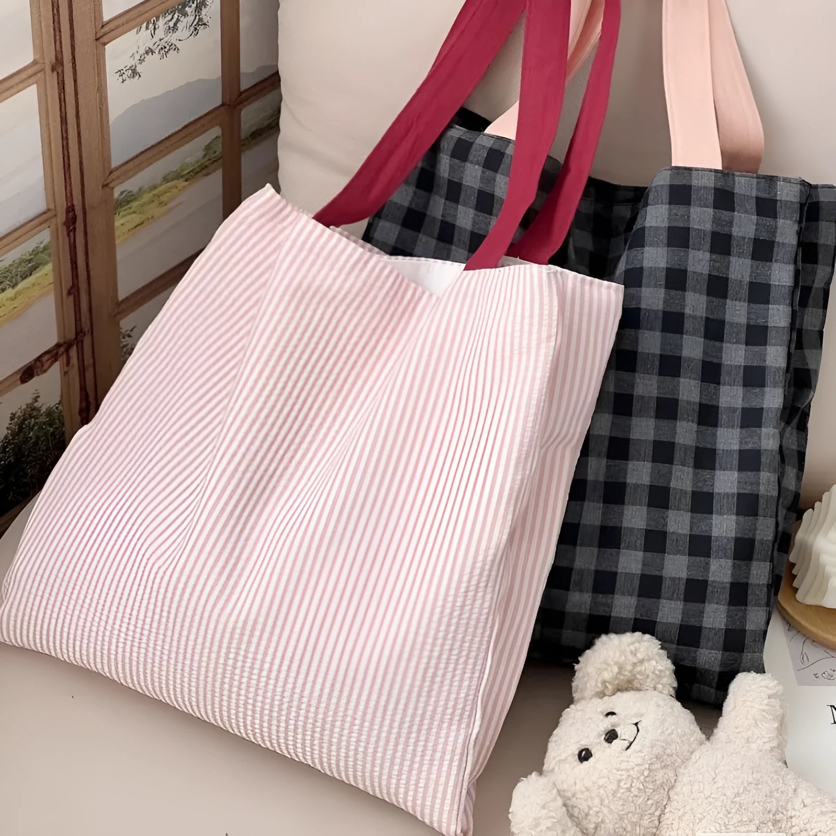 Cotton canvas multi-layer tote shoulder bag in plaid or striped pattern options with wide straps.