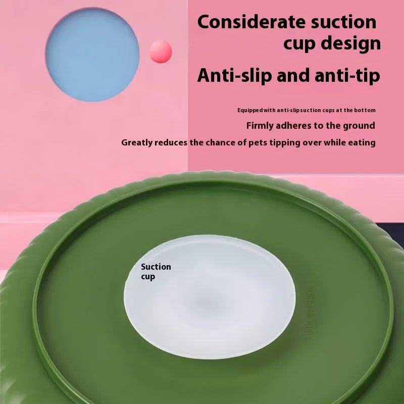 Grey pet slow feeder bowl with rotating windmill-pattern top and a white anti-choke silicone pad in the centre.