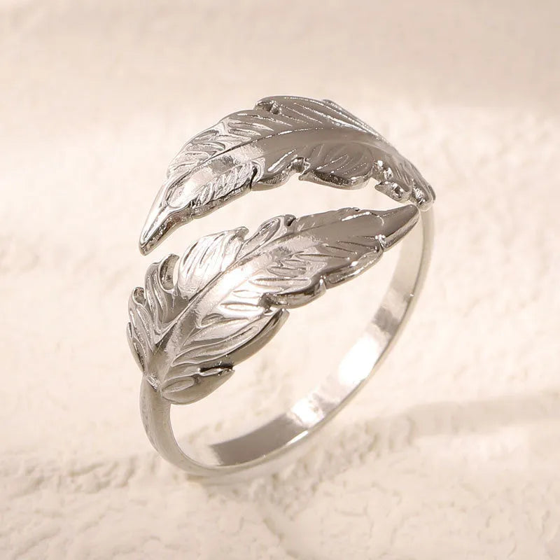 Adjustable stainless steel feather ring with electroplated silver or gold finish